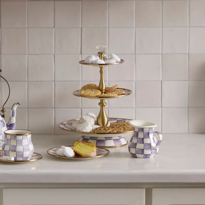 Violet check three-tier sweet stand with a round base measuring 12 inches in diameter and standing 14 inches tall.