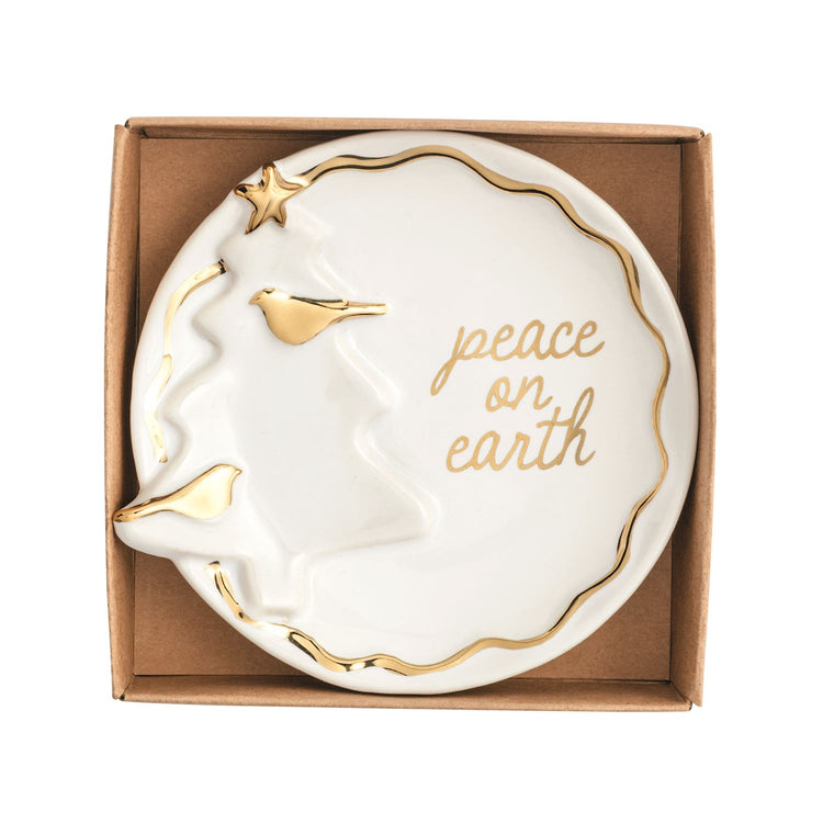 Round white stoneware trinket dish with gold tree, birds, and 'peace on earth' script in a box.