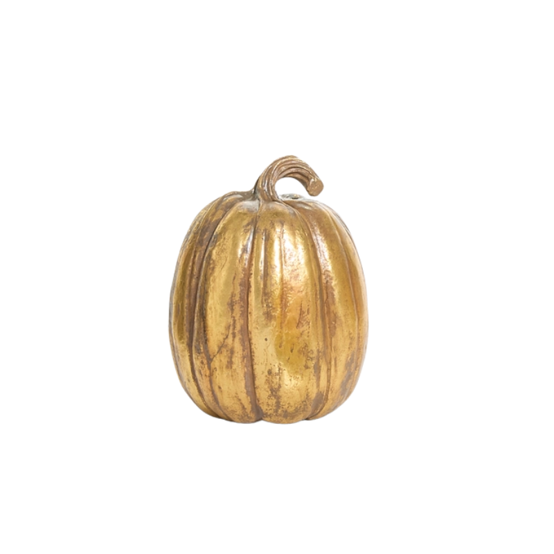 A tall, decorative gold resin pumpkin with a metallic finish and a curved stem.