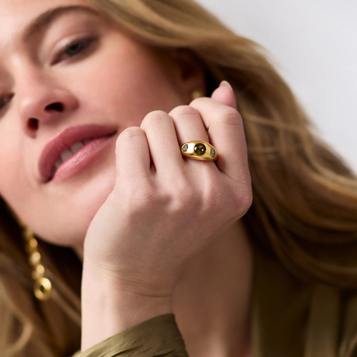 Rainbow signet ring with gold plate finish featuring a colorful CZ stone in an oval silhouette.