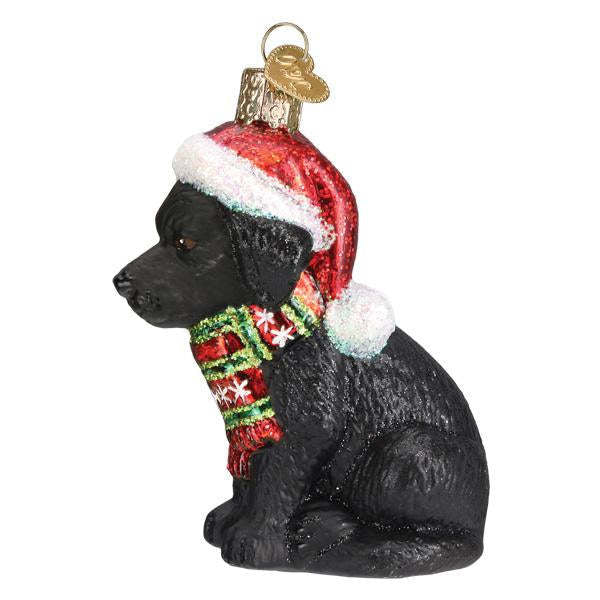 Holiday ornament shaped like a black Labrador puppy with glossy finish