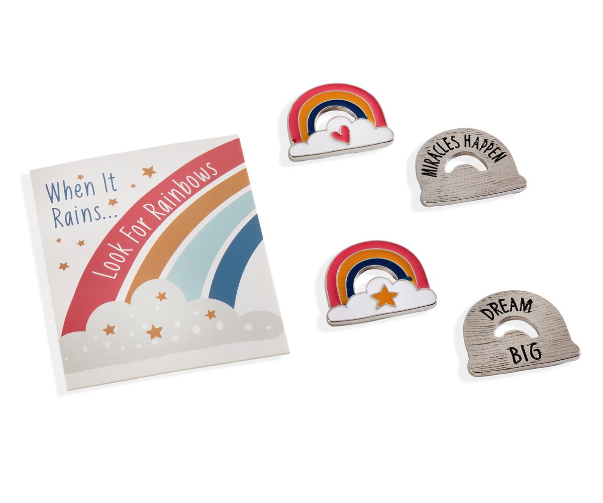 Rainbow tokens with inspirational text and designs, including a card that says 'When It Rains... Look For Rainbows'.