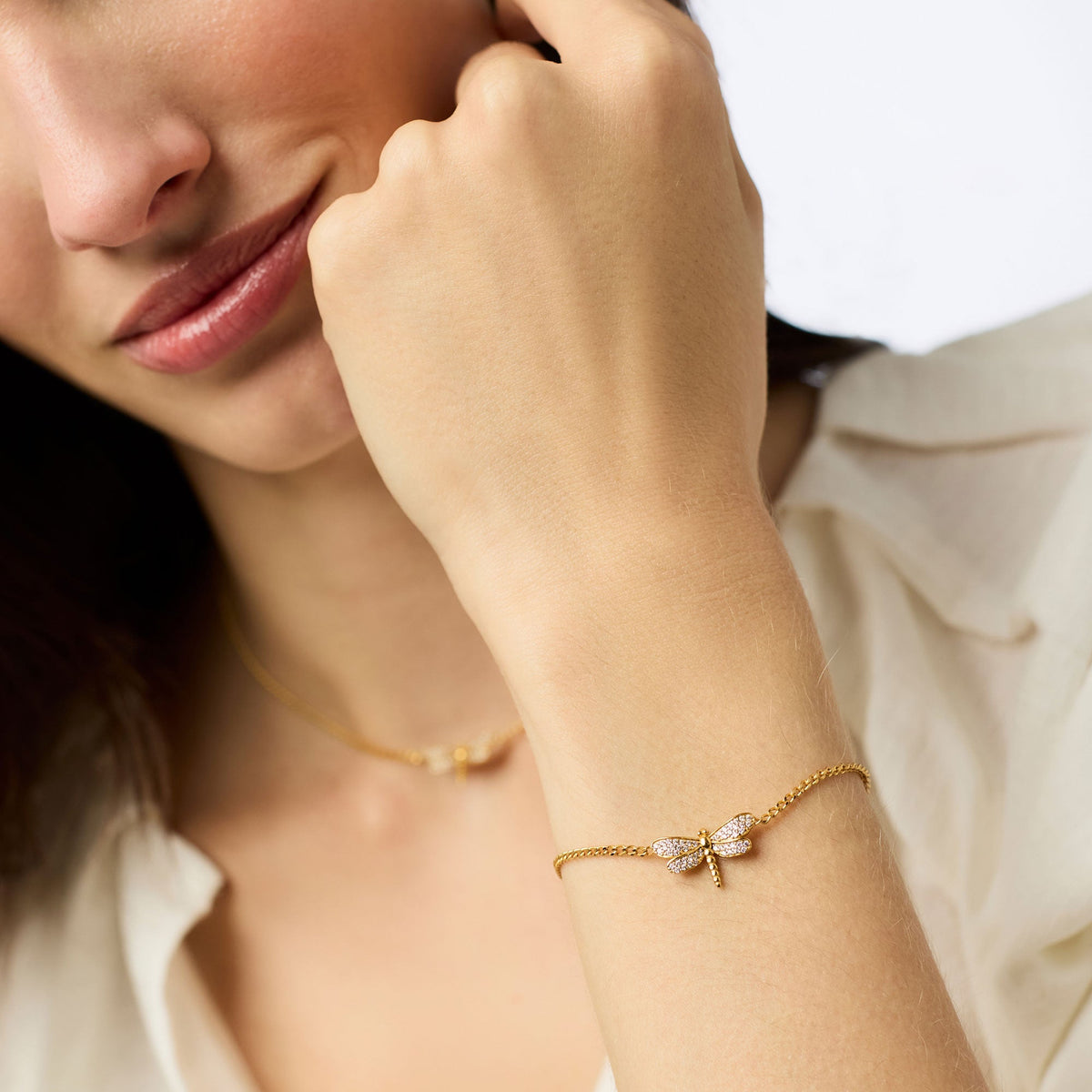 Delicate dragonfly pave bracelet in gold plate with cubic zirconia stones