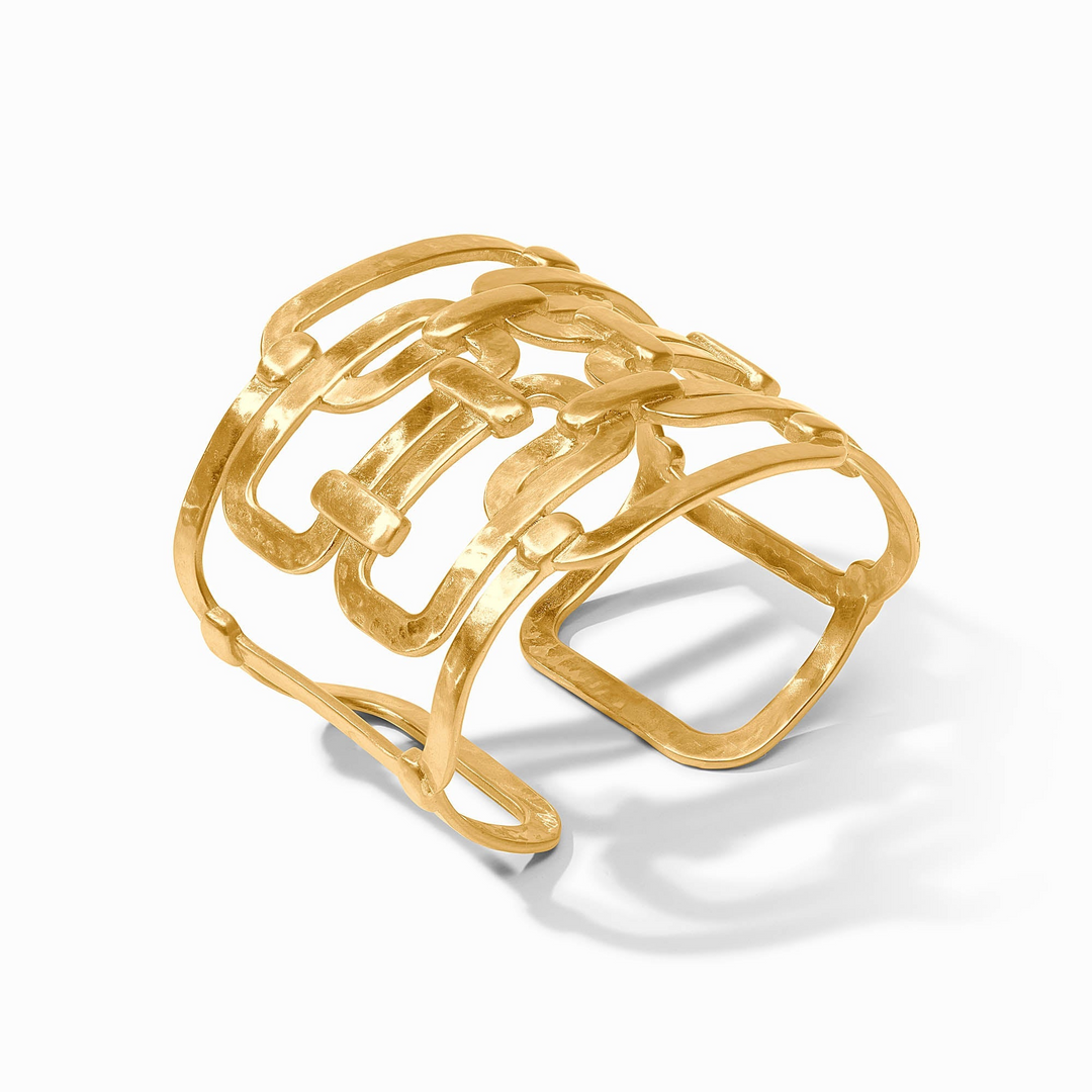 Sahara Statement Cuff, a wide gold-toned bracelet with an open, interlocking geometric design.