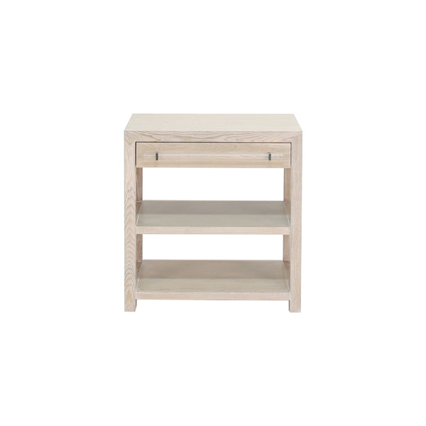 Garbo Co side table with a rectangular top in light wood finish on four tapered legs.