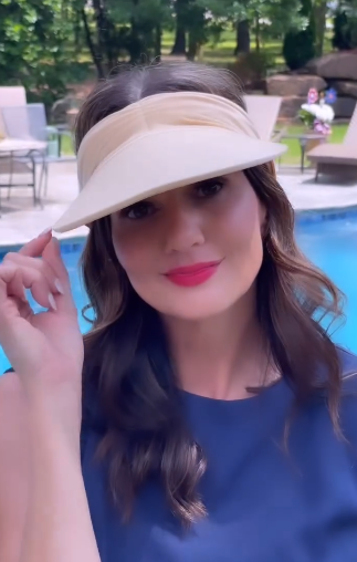 Women's open-top sun visor hat with wide brim in bright contrasting colors and elasticized chinlon fabric.