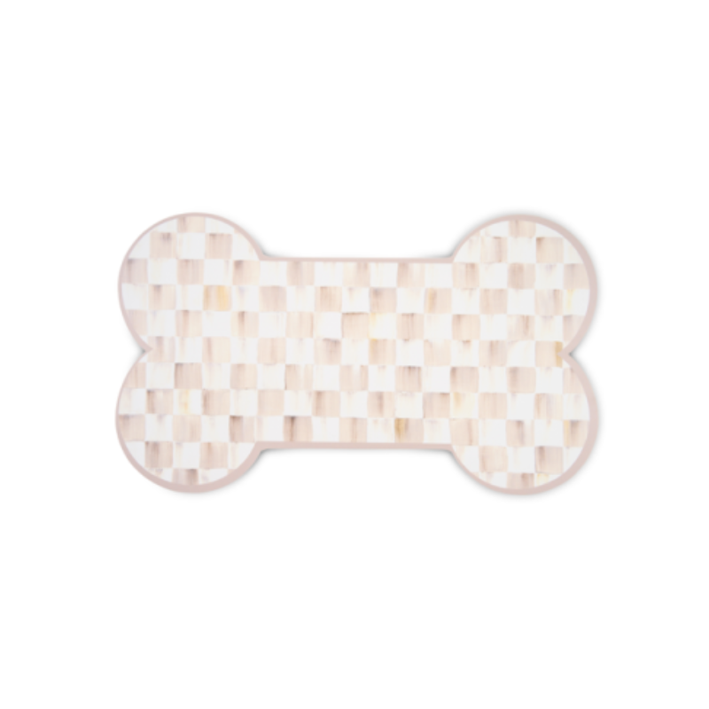 Bone-shaped placemat with a light pink and white checkered pattern.