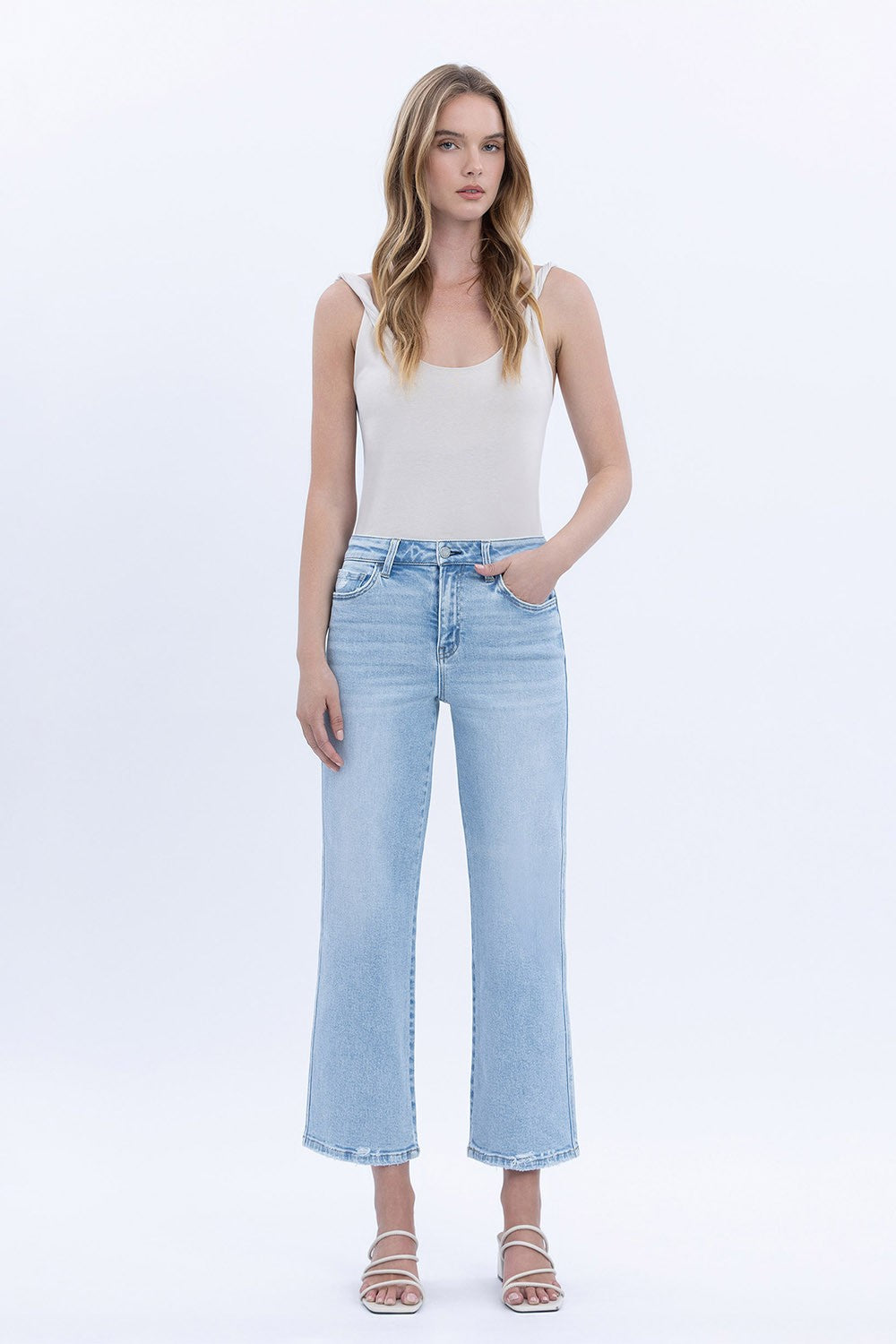 Cindy high-rise light wash slim wide jeans in a crop length with visible stretch fabric.