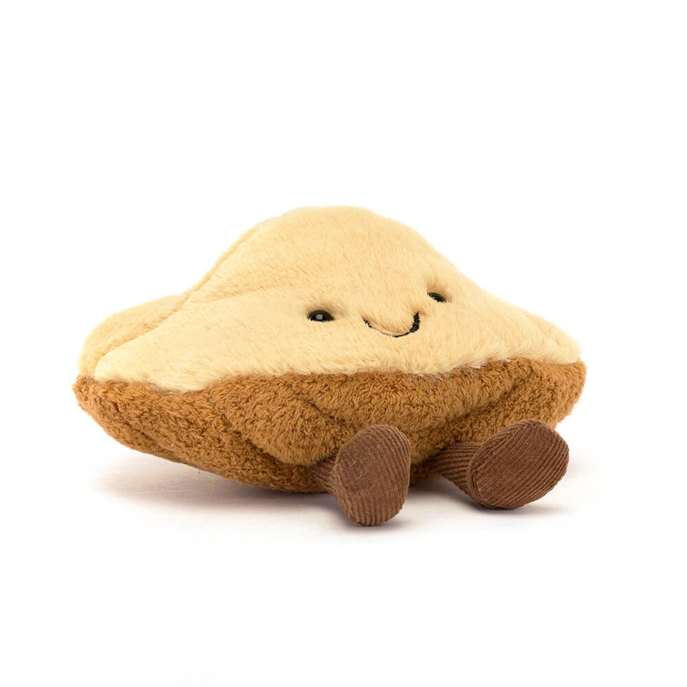 Amuseables Margaux Madeleine plush toy with a smiling face and cordy brown legs.