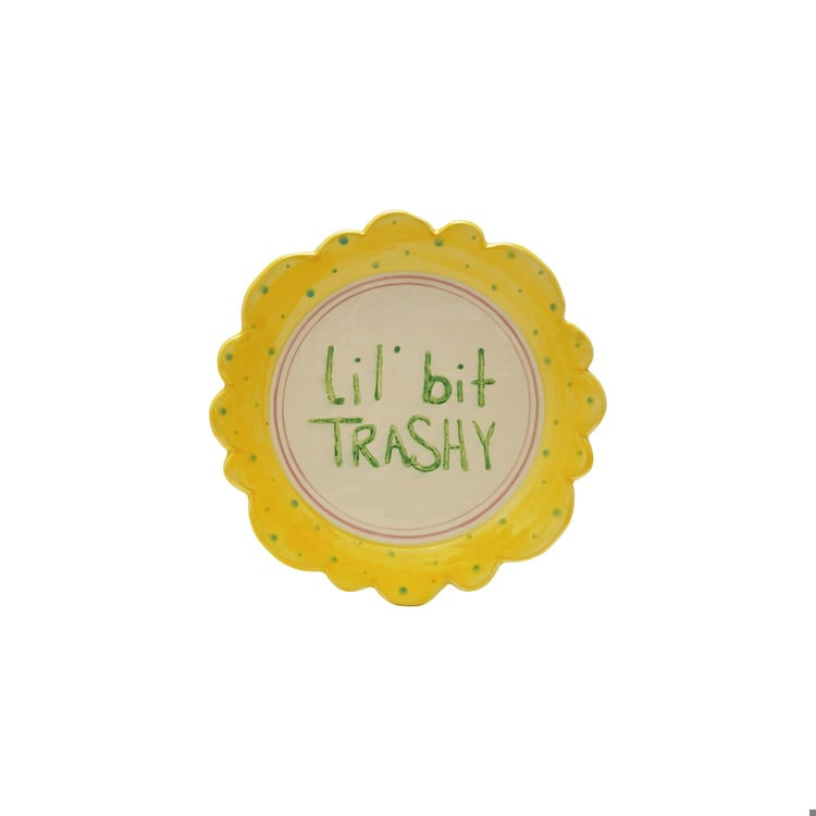 Hand-painted 10" stoneware plate with yellow scalloped edge, dots, and "Lil' bit TRASHY" text.
