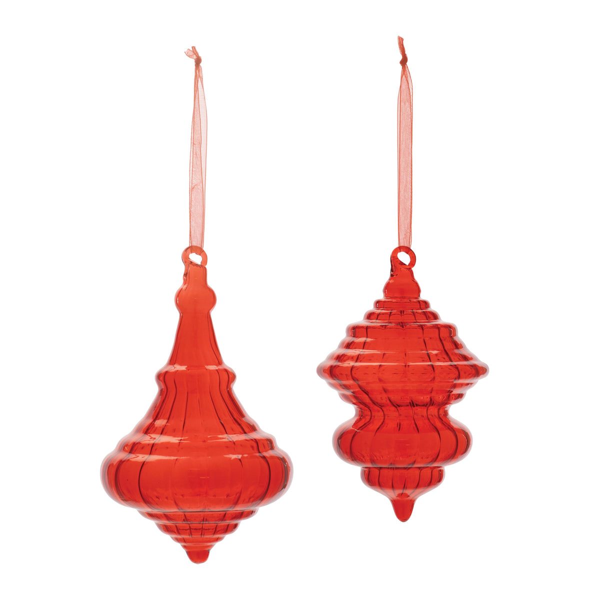 Two translucent red glass ornaments with classic sculptural shapes and matching hanging ribbons.