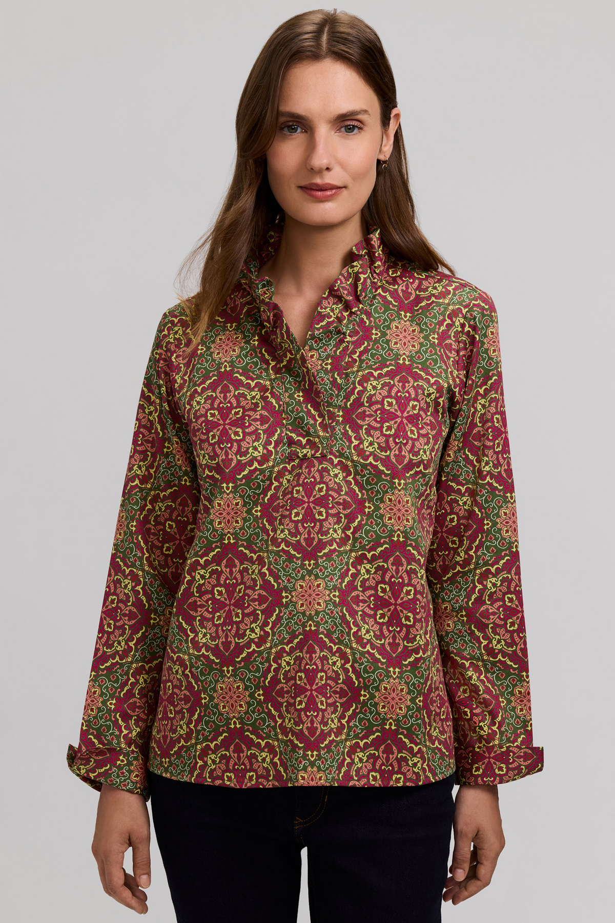 Woman wearing the Tammy Fall Medallion Long Sleeve Popover with a ruffle neckline.