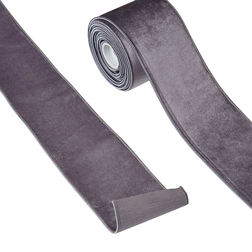 4 inch wide amethyst purple velvet wired ribbon on a roll and unrolled.