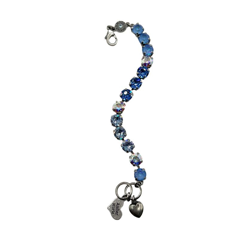 Classic Santorini bracelet featuring blue ombre stones, an amber tag with a crystal, and a Scotty dog heart charm.