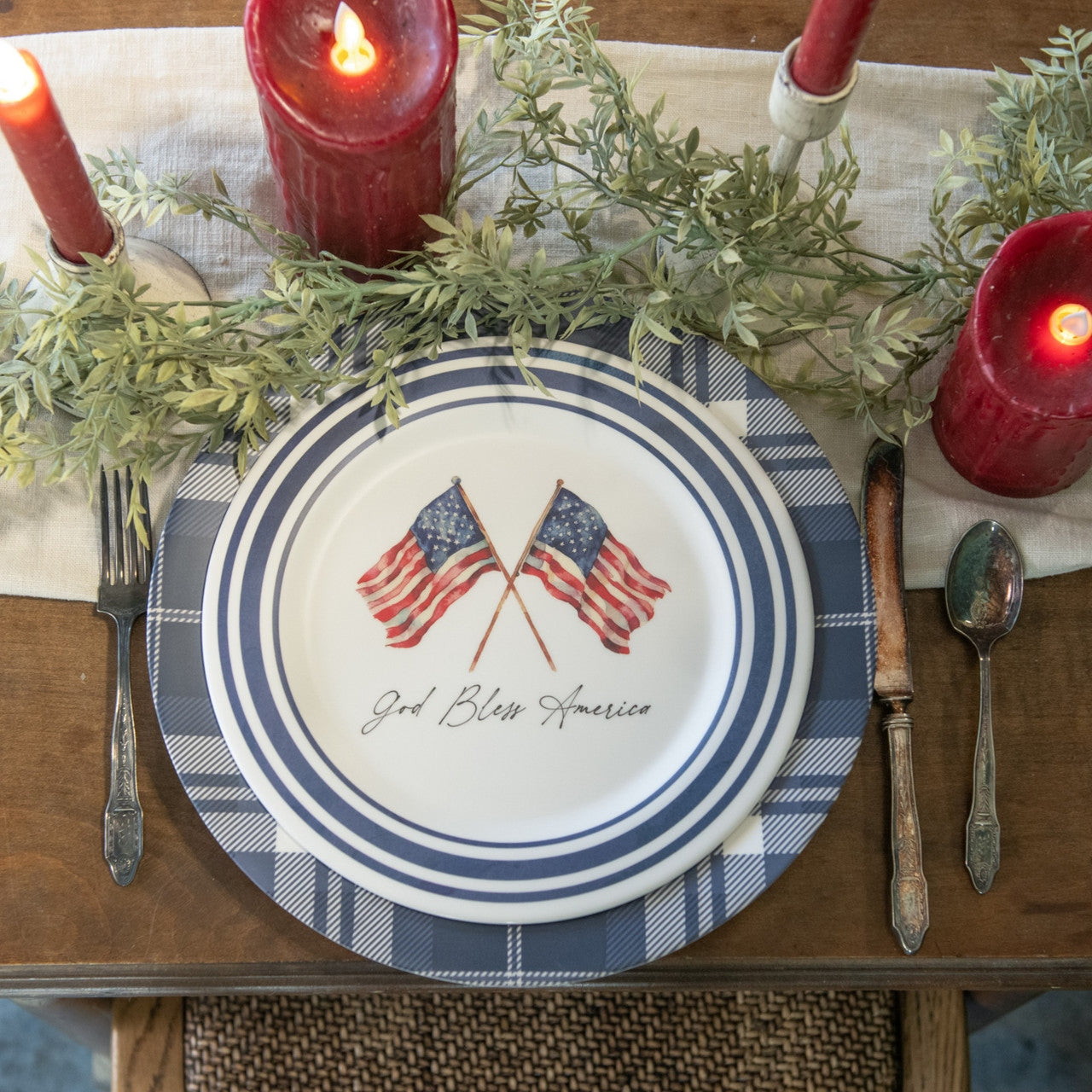 Metal American flag plate with red stars on a blue canton and white stripes.