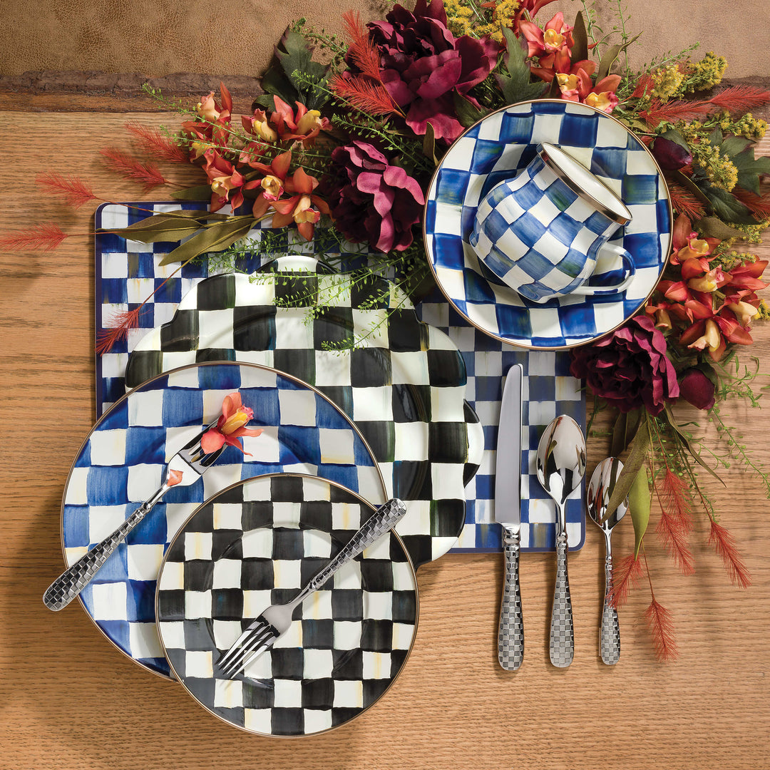 Royal Check breakfast bowl and mug set on a table with floral accents and checkered dinnerware.