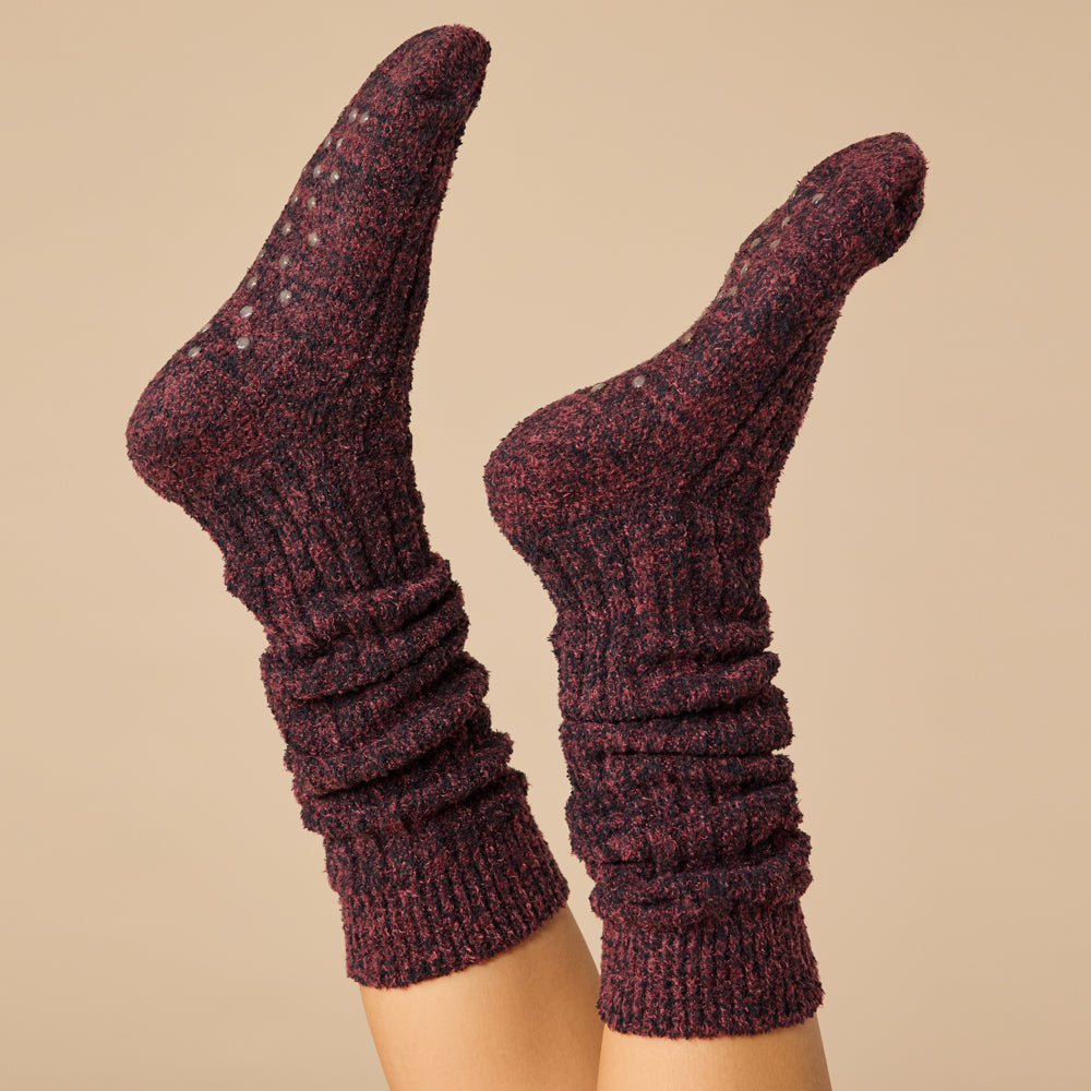 Slouchy marshmallow socks in heathered gray with non-slip grippers on the sole.