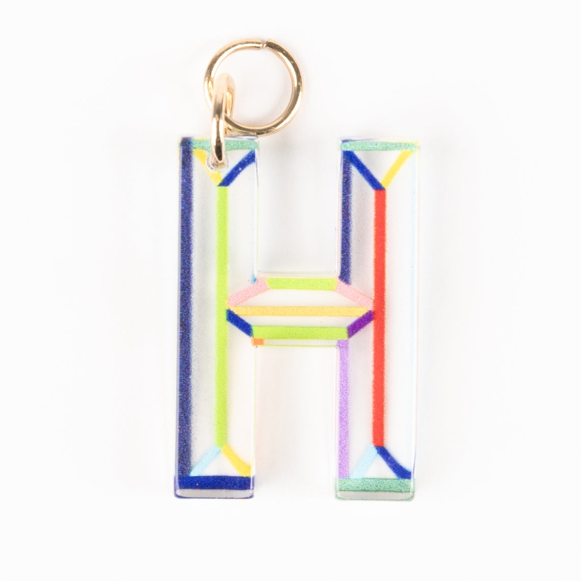 Marlow Initial Bag Charm featuring a clear acrylic letter H with colorful geometric line patterns.