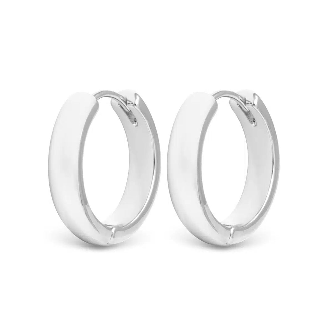 Pair of Stacy Small Hoop Silver Earrings with a polished finish and hinge closure.