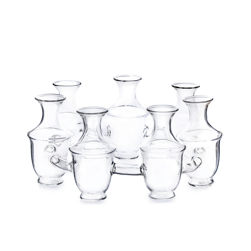 Clear glass vase with a cylindrical silhouette measuring approximately 10 inches tall.