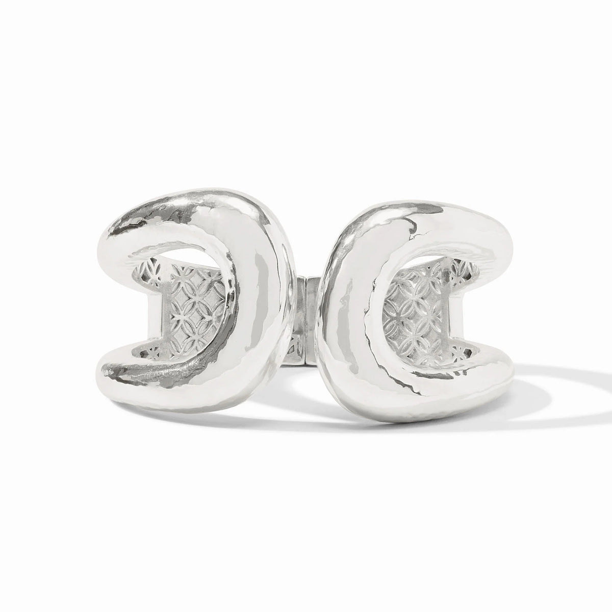 Solara Cuff in silver featuring a bold, sculptural double-C design with a textured inner band.