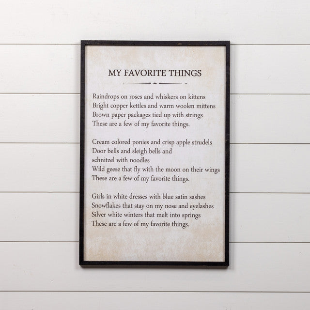 Wooden wall sign shaped like a decorative frame with the text 'My Favorite Things' in white lettering.