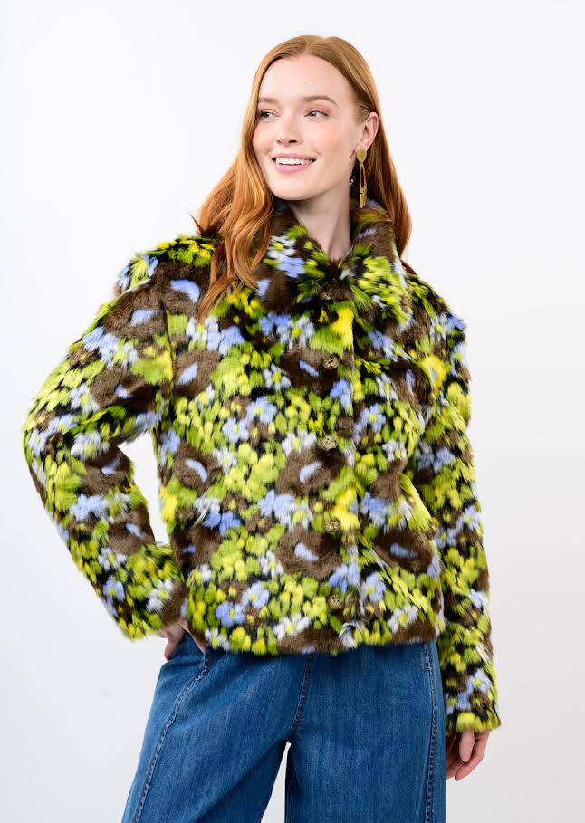 Woman wearing the Sophia Floral Faux Fur Jacket in a green, blue, and brown floral pattern.