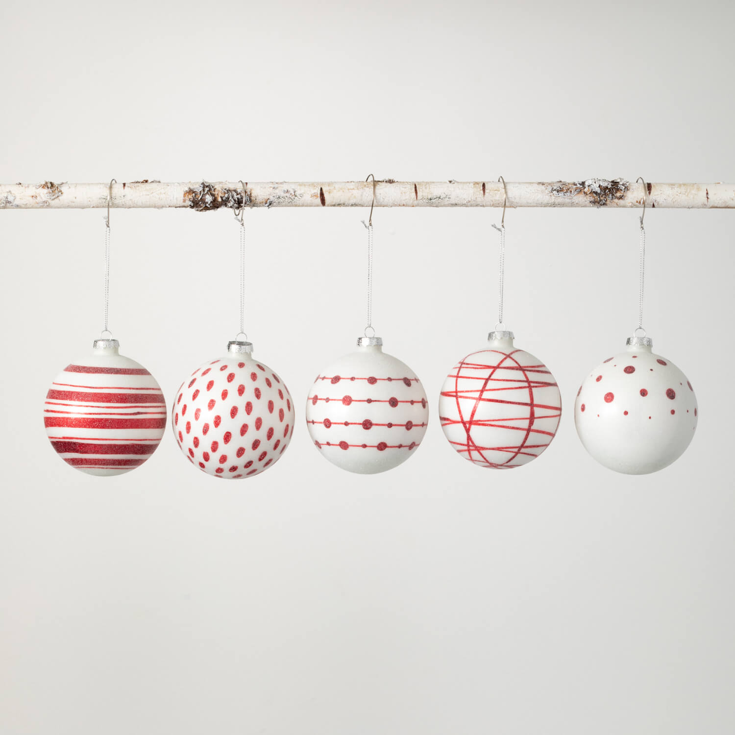 Multicolor glass ball ornament with a geometric patterned surface.
