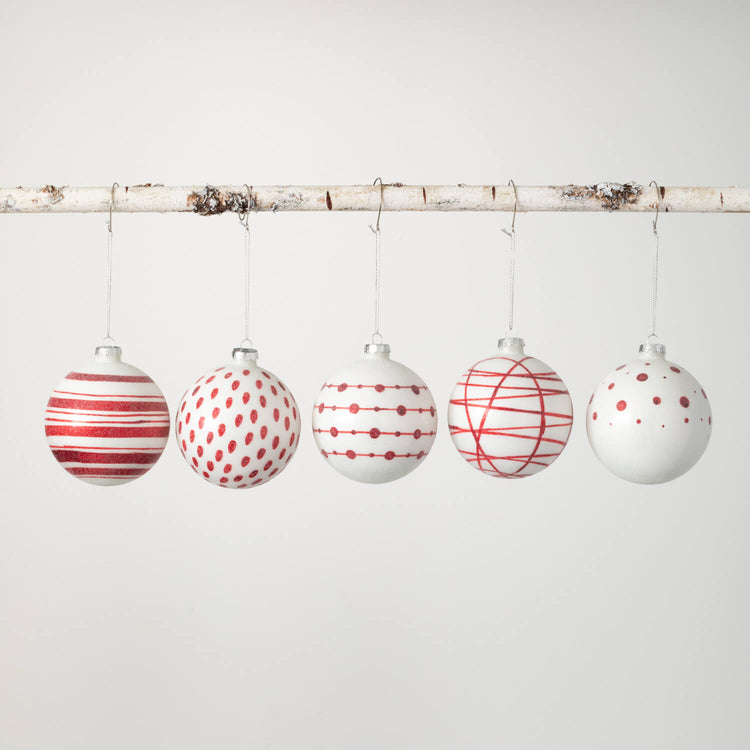 Multicolor glass ball ornament with a geometric patterned surface.