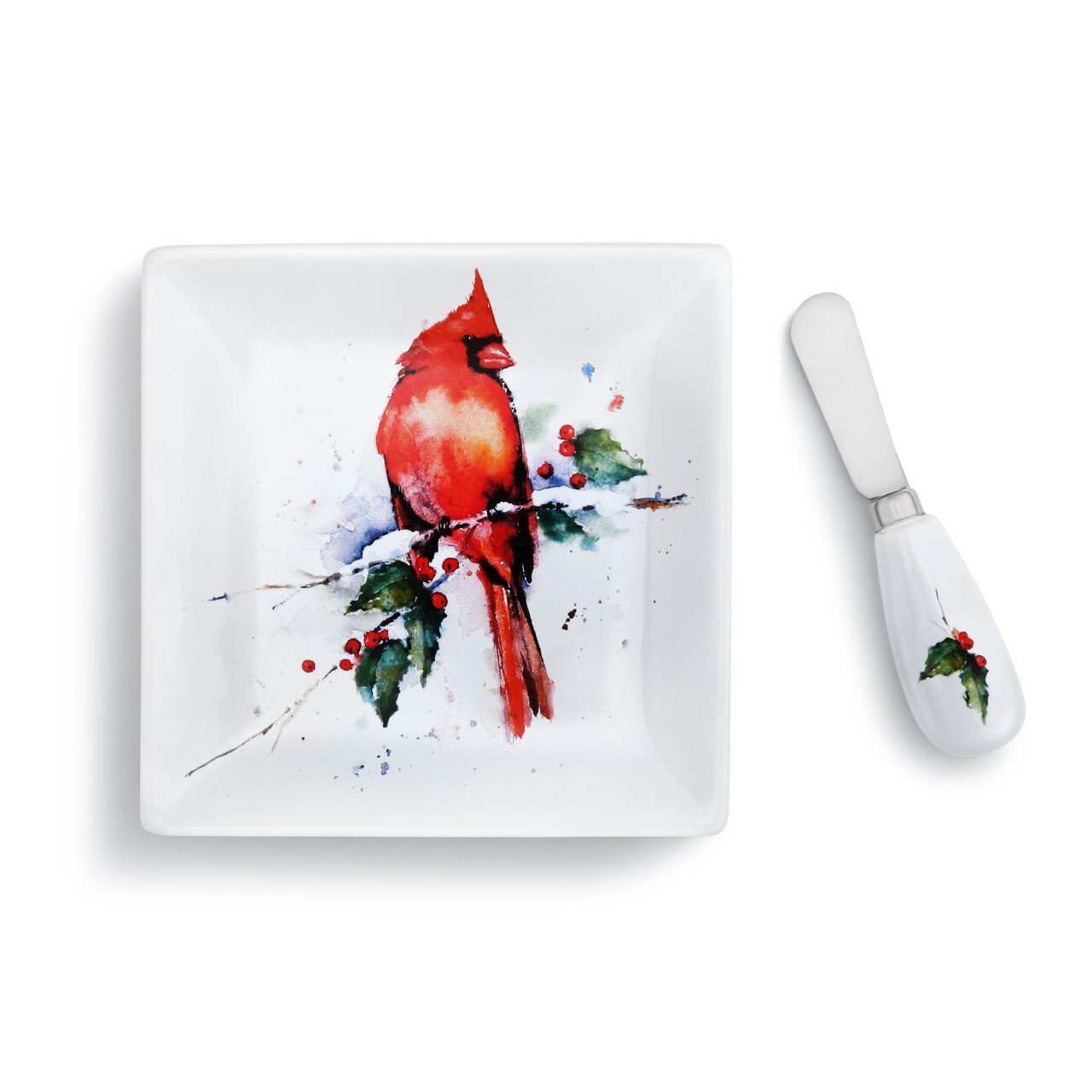 White square plate and spreader set with a watercolor cardinal on a branch with holly berries.