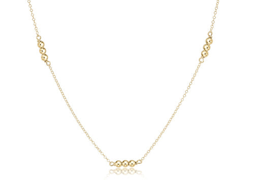 Gold-filled choker necklace with a 3mm chain featuring small gold beads.