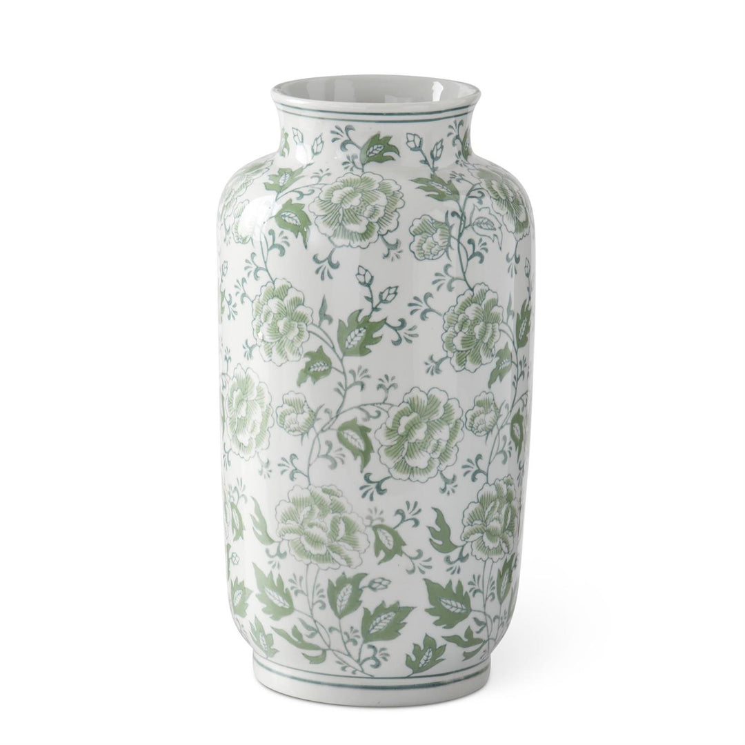 Ceramic vase with green and white floral pattern on a neutral background