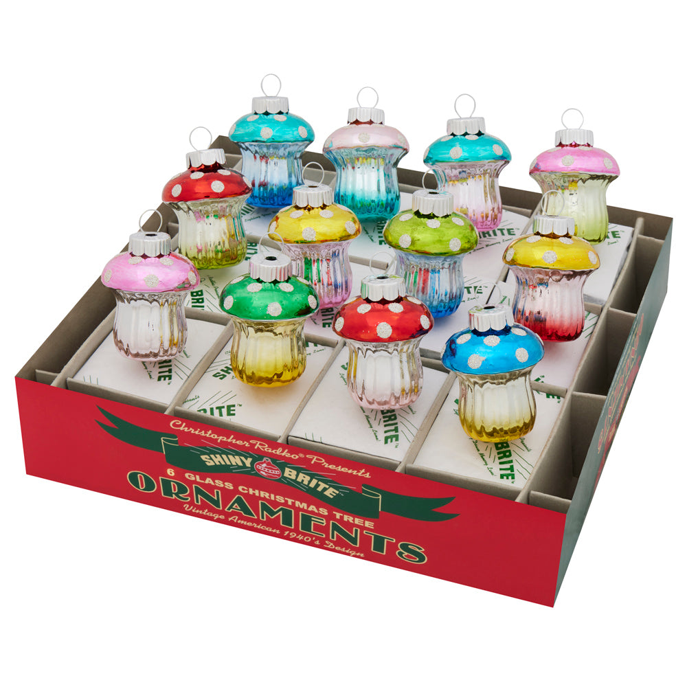 Set of 12 colorful glass mushroom Christmas ornaments in a red and green display box.