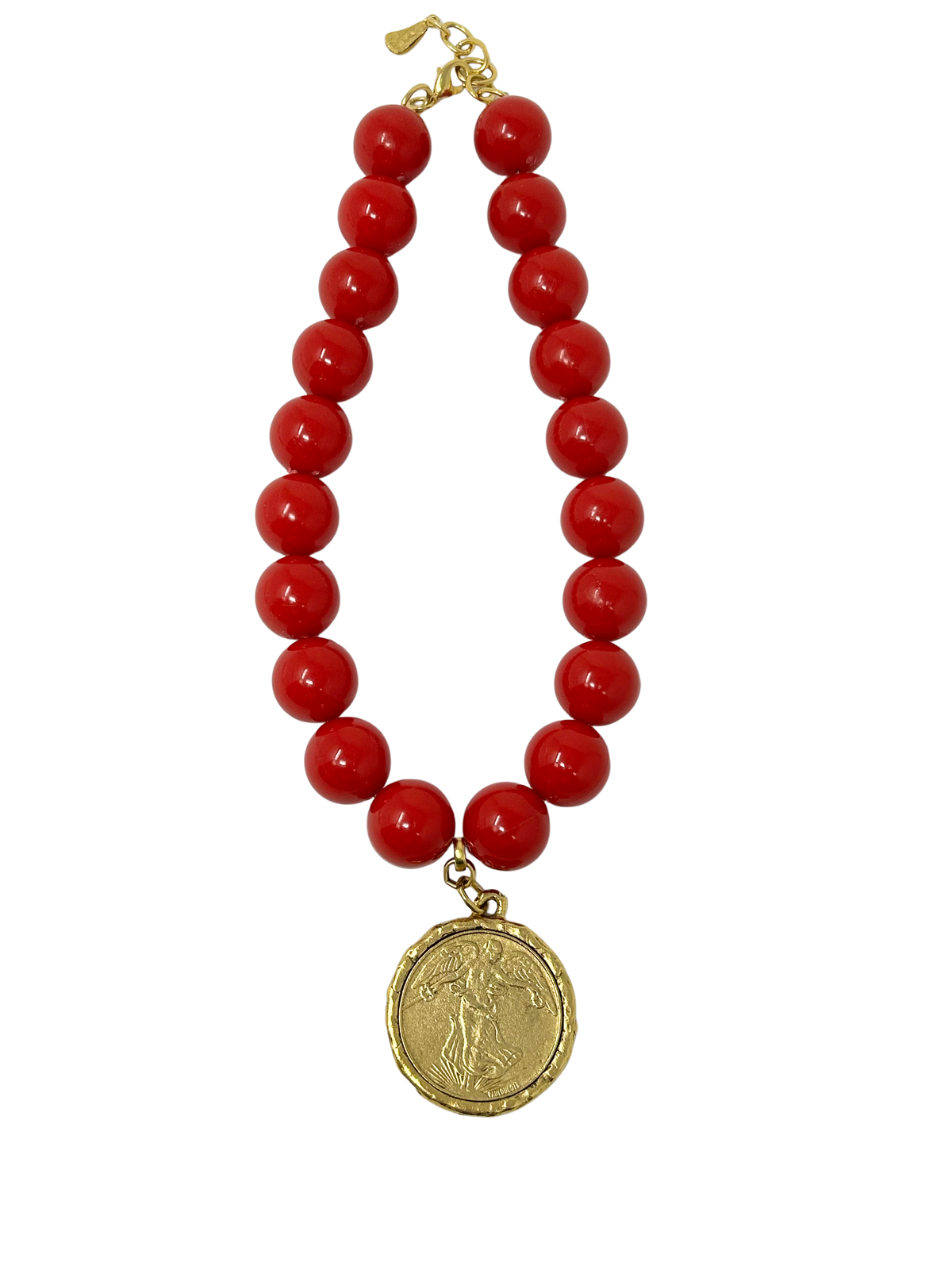 Vintage 18-inch necklace featuring large red beads and a 1-inch gold-tone coin medallion pendant.
