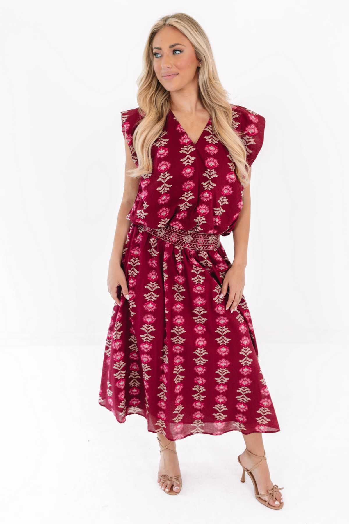 Woman wearing the wine-colored Jane The Bubble Top with a matching Athena Midi Skirt.