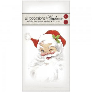 Four white cotton napkins with decorative graphics in a sealed cello bag.