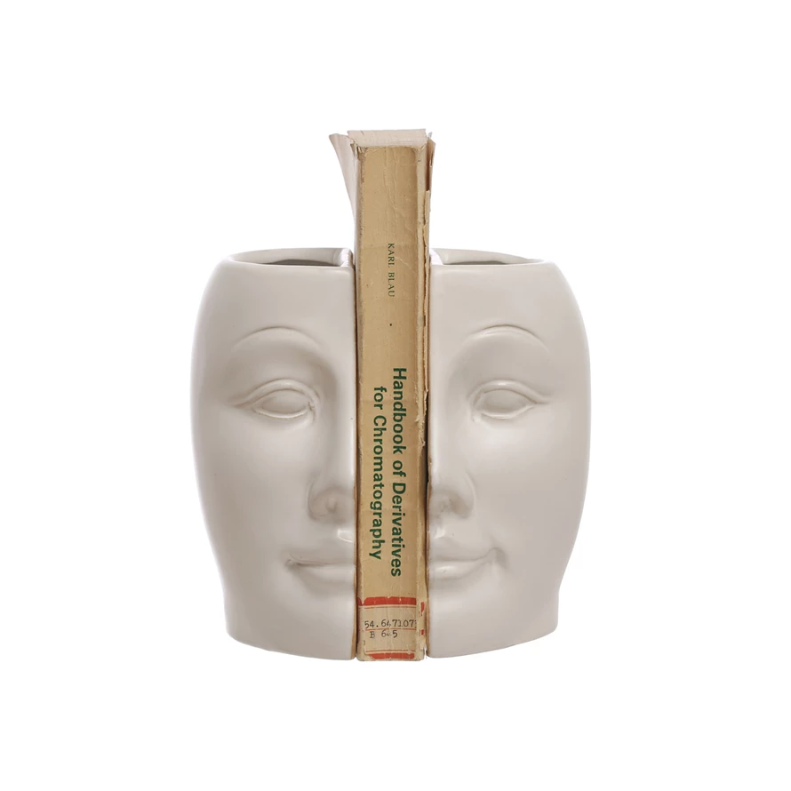 White stoneware face vase with reactive glaze finish