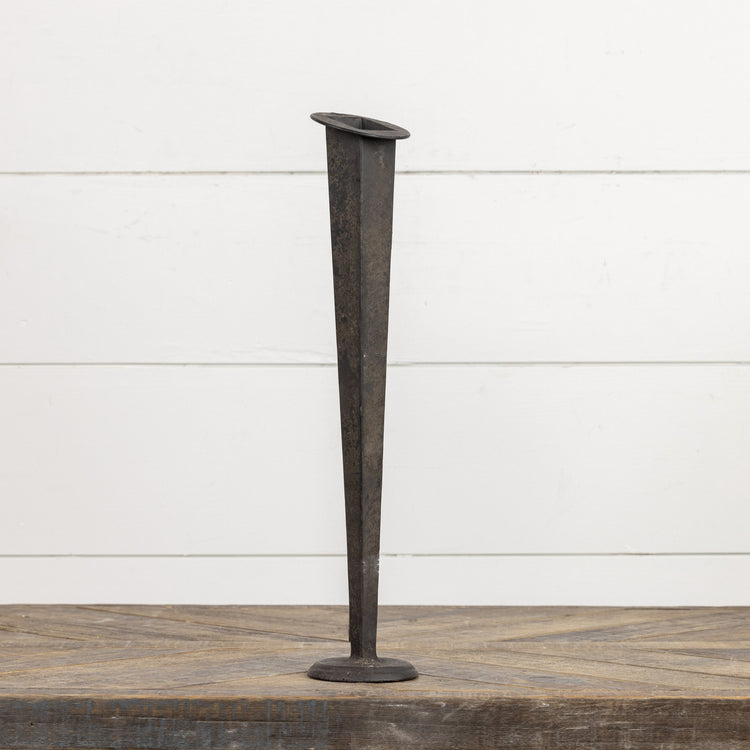16.5-inch tall black tapered metal vase with a circular base on a wooden surface.