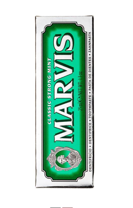 Tube of Marvis Classic Strong Mint toothpaste with a white body and green cap.
