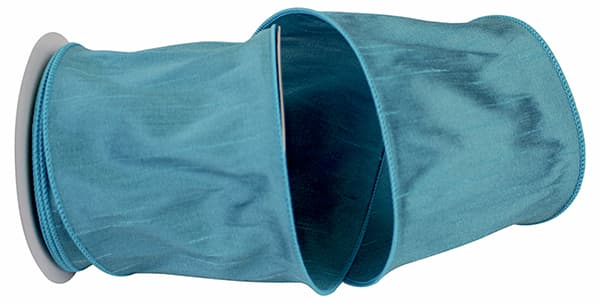 Four-inch wide turquoise Dupioni Supreme wired edge ribbon made from 100% polyester.