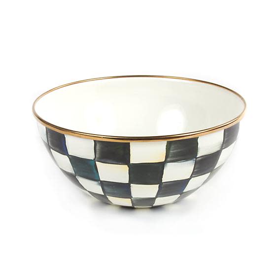 Small enamel bowl with hand-painted black and white checks and a bronzed stainless steel rim.