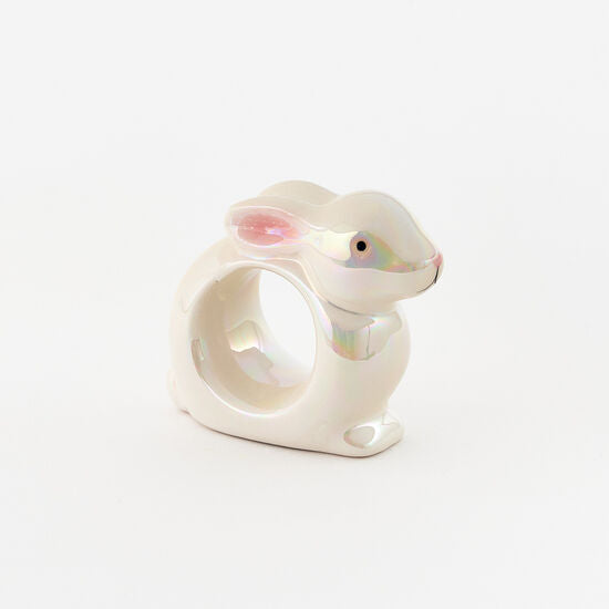 Ceramic bunny napkin ring with a pastel pink finish.