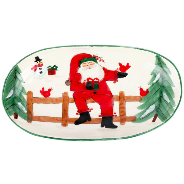 Old St. Nick Shallow Oval Bowl featuring a hand-painted Santa sitting on a fence with birds.