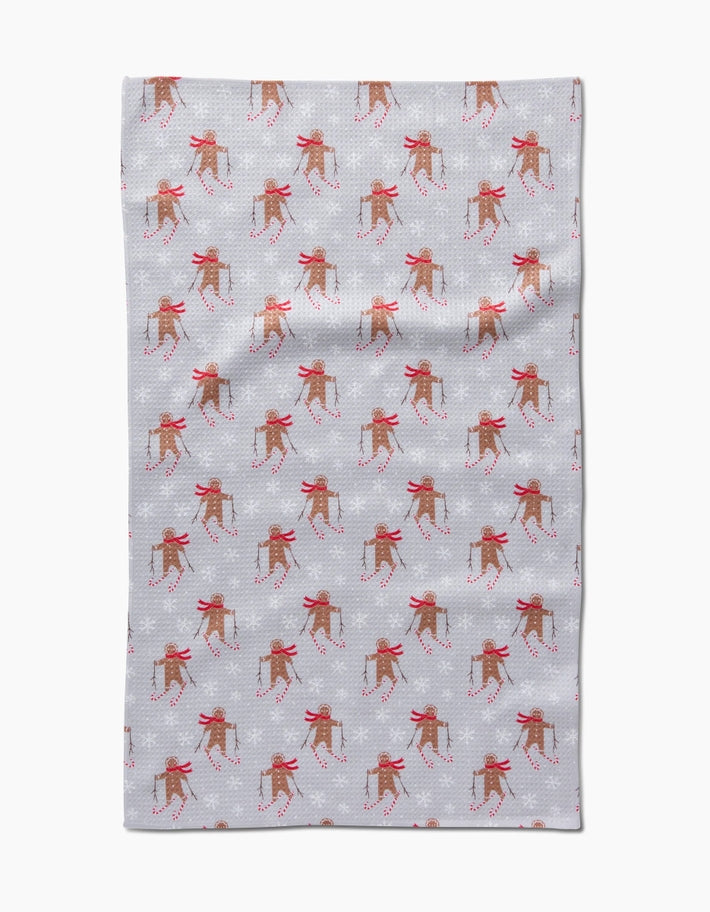Holiday tea towel with waffle weave construction in red featuring a festive snowman pattern.