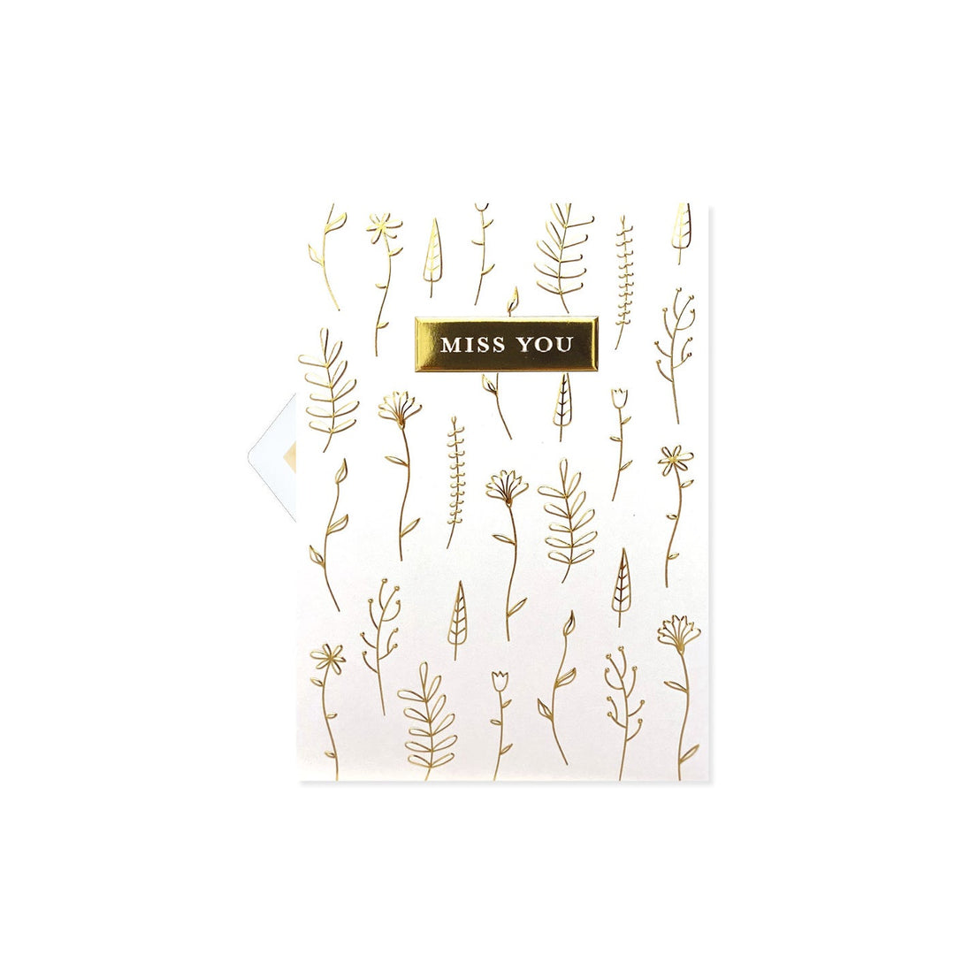 White card featuring a doodle flower illustration with the text Miss You.