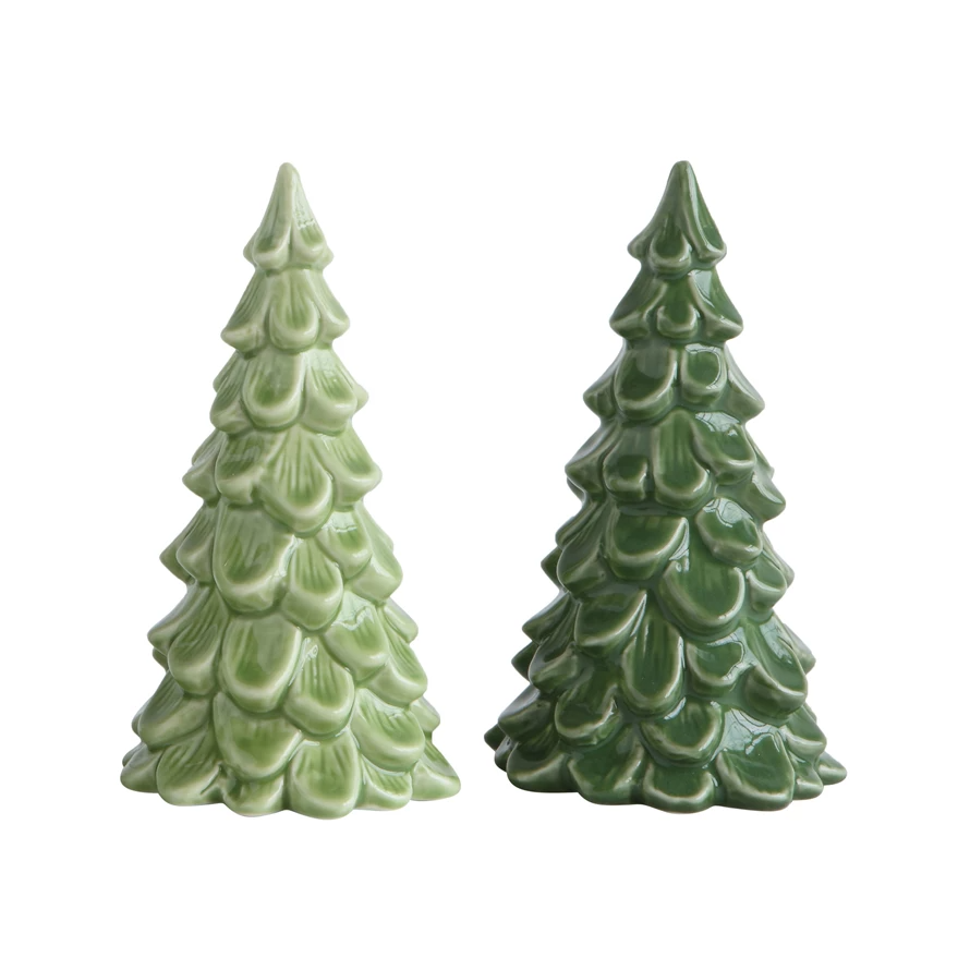 Stoneware tree figurine in dark green with textured bark pattern on a natural wood base.