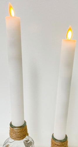 Set of three unscented LED taper candles with realistic moving flame technology in warm white.