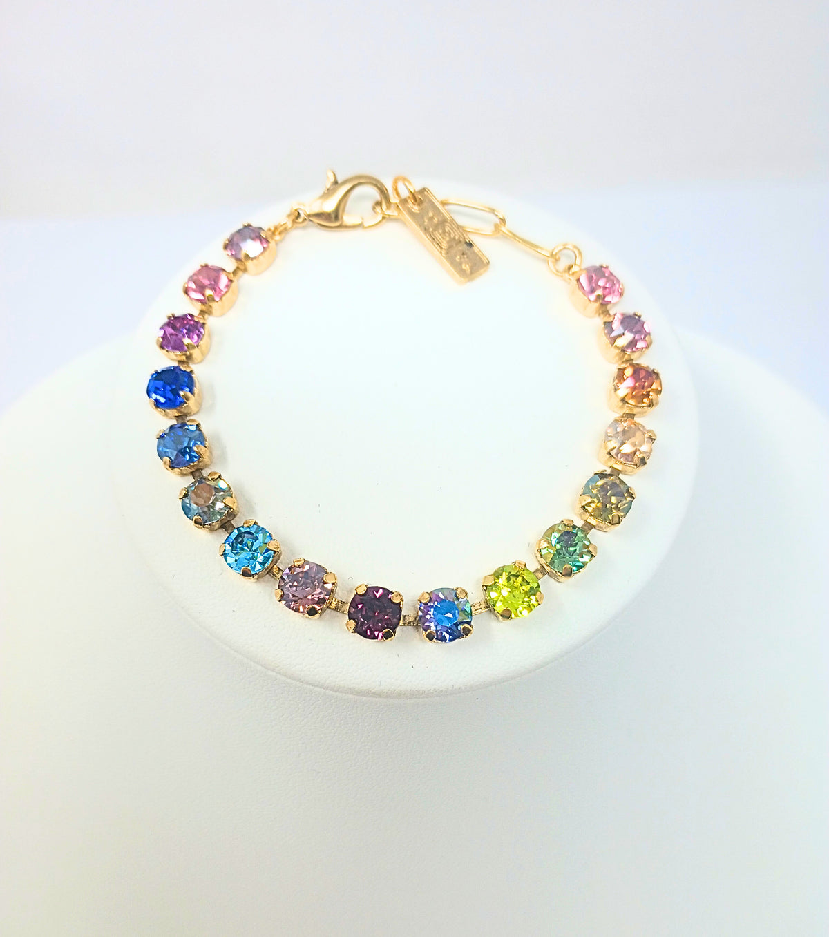 Sarina Bracelet featuring multi-colored crystals in an antique gold-plated setting.