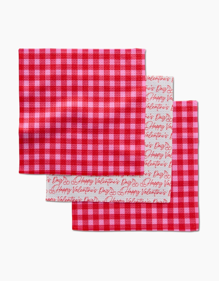 Set of three waffle weave dishcloths in recycled polyester with single-sided prints and hang loops.