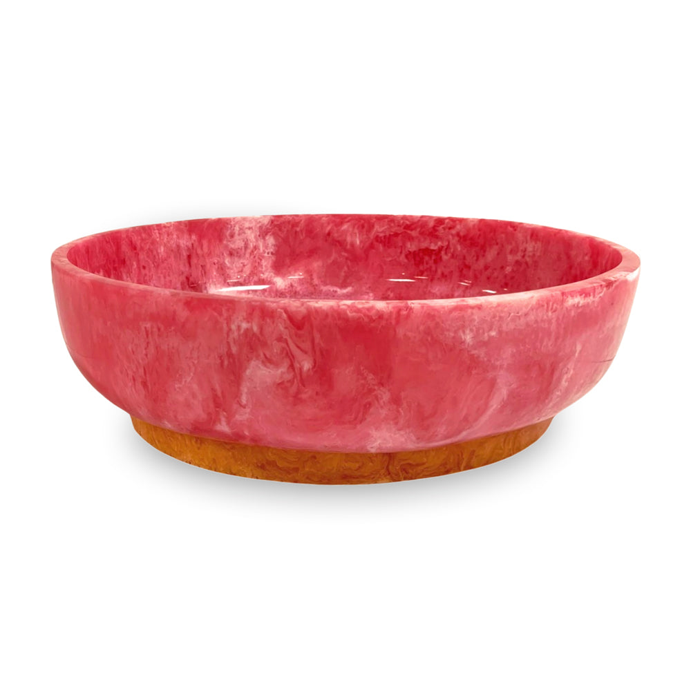 Large oval pink marbled resin bowl with a contrasting amber-colored base.